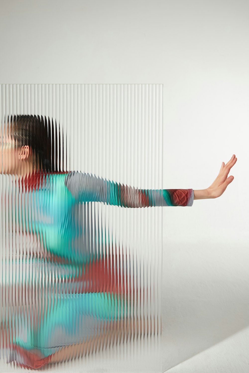 a woman in a blue and red dress is dancing