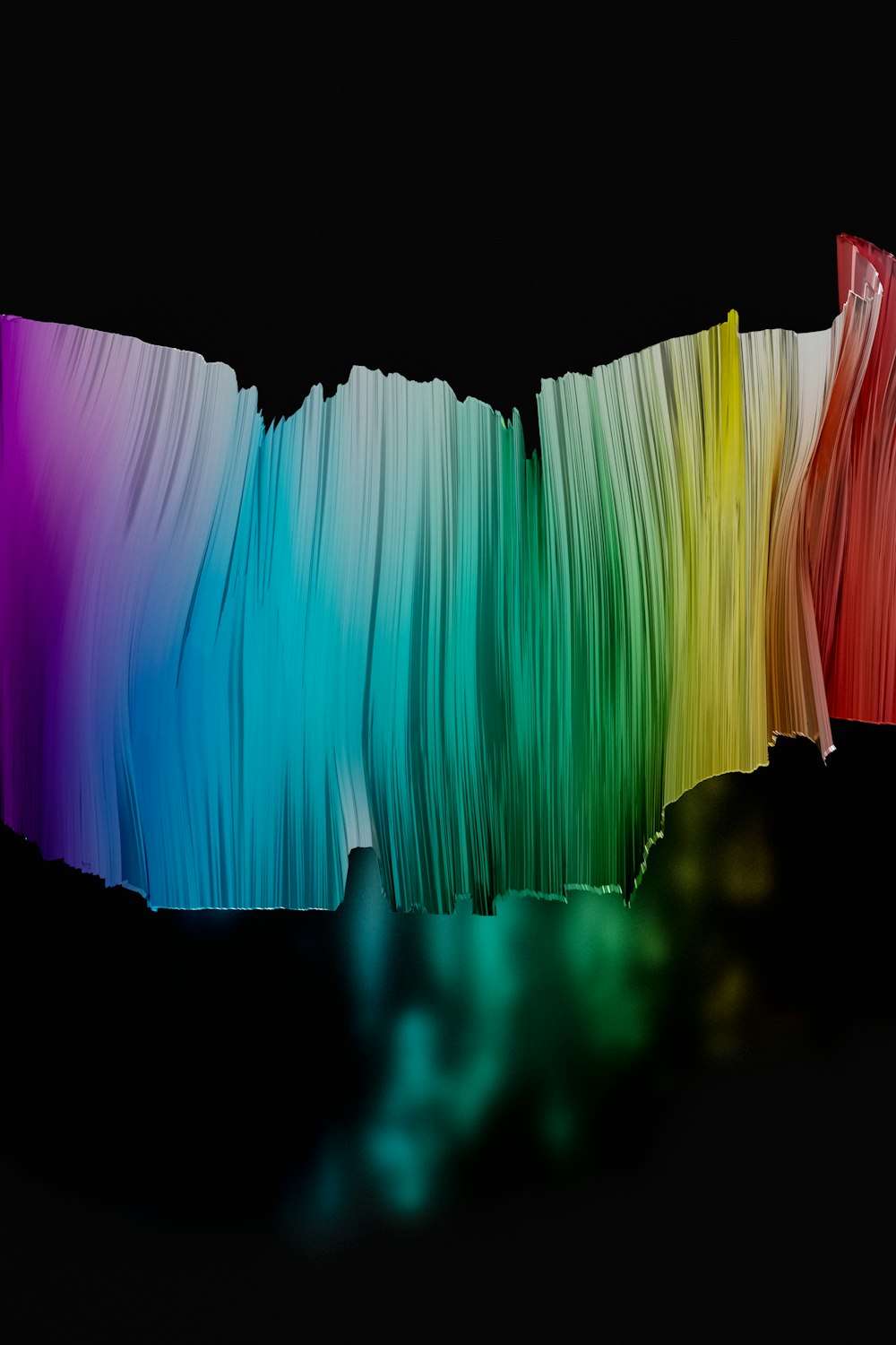 a multicolored piece of paper on a black background