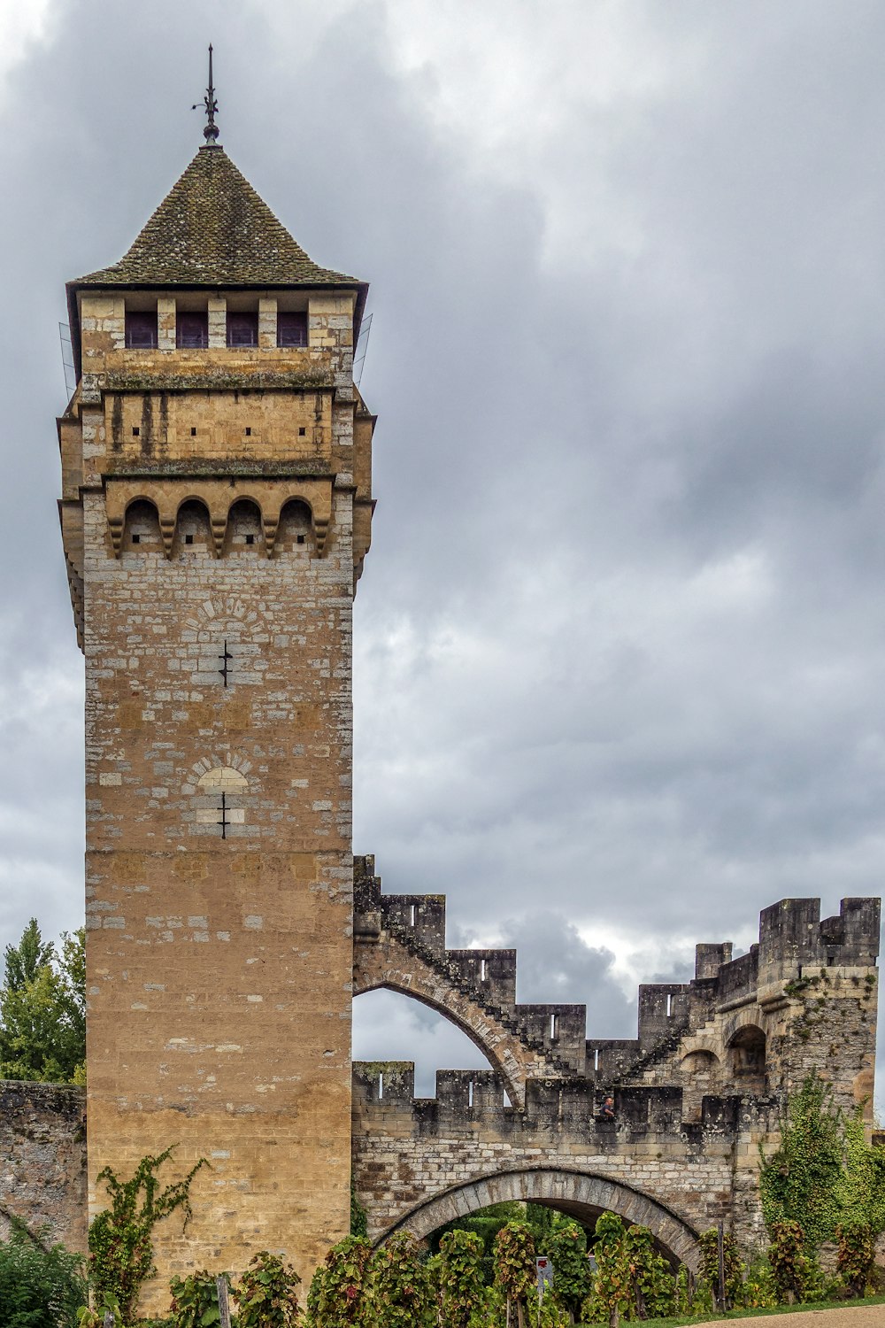 a tall tower with a clock on the top of it