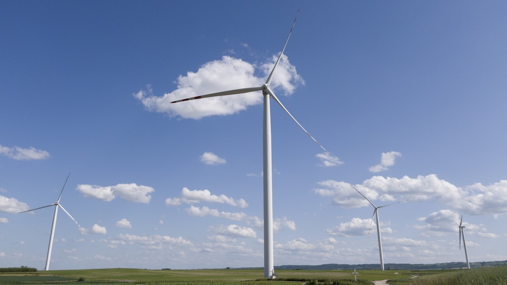 a group of wind turbines in a field