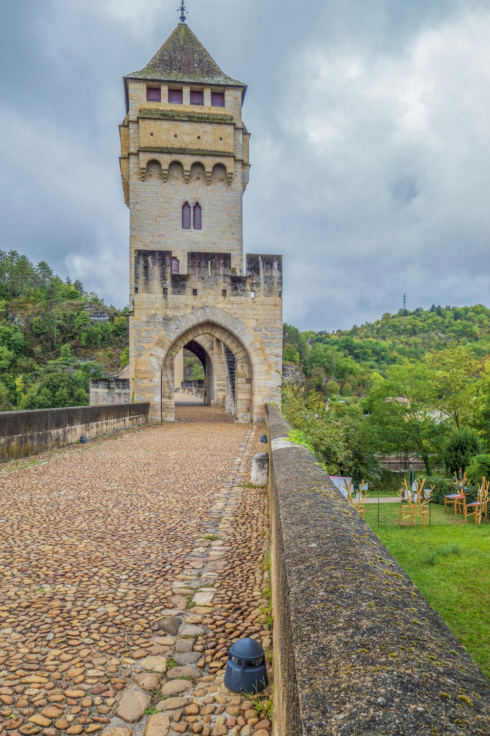 a stone bridge with a tower on top of it