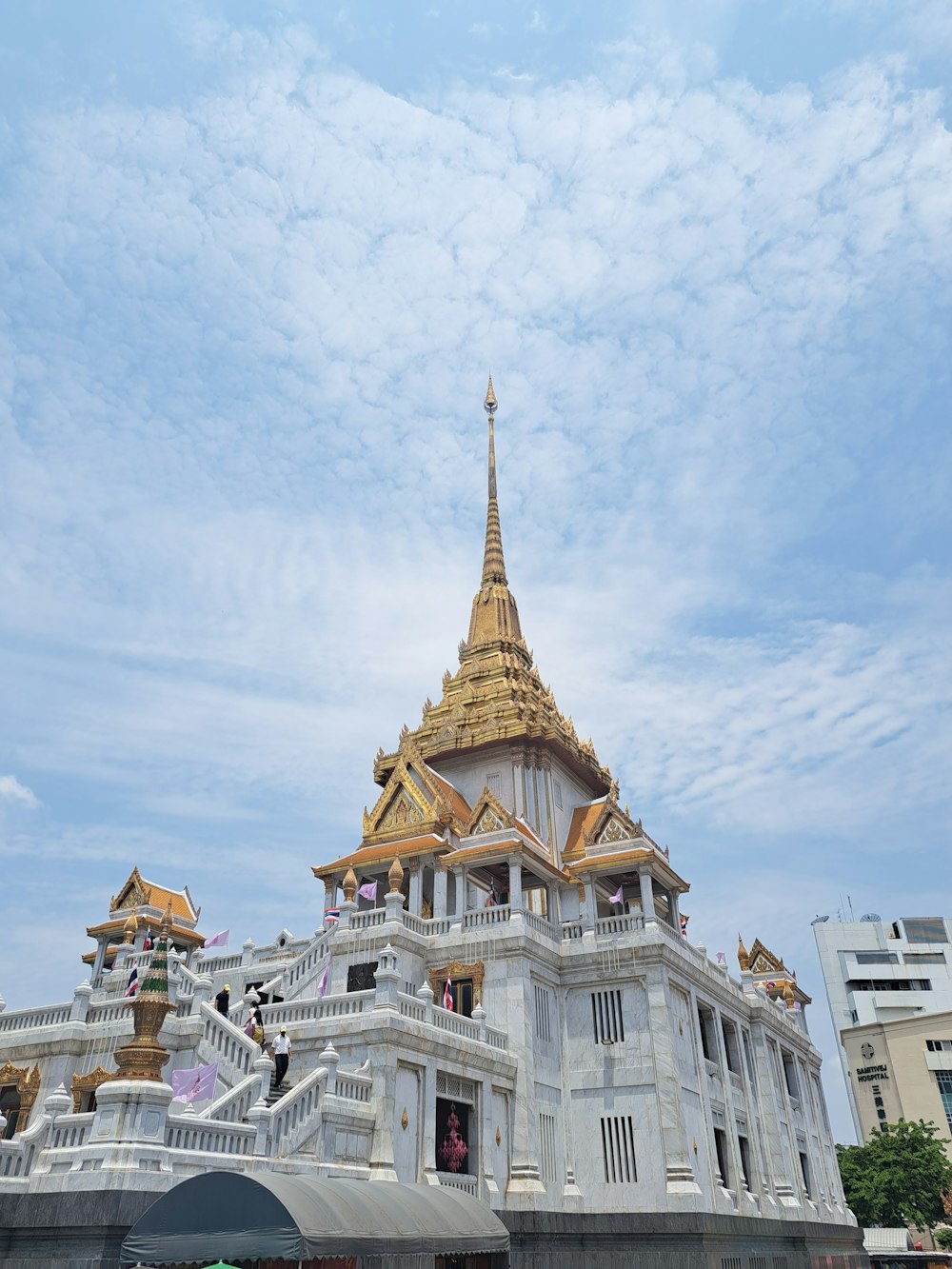 a large white building with a golden roof