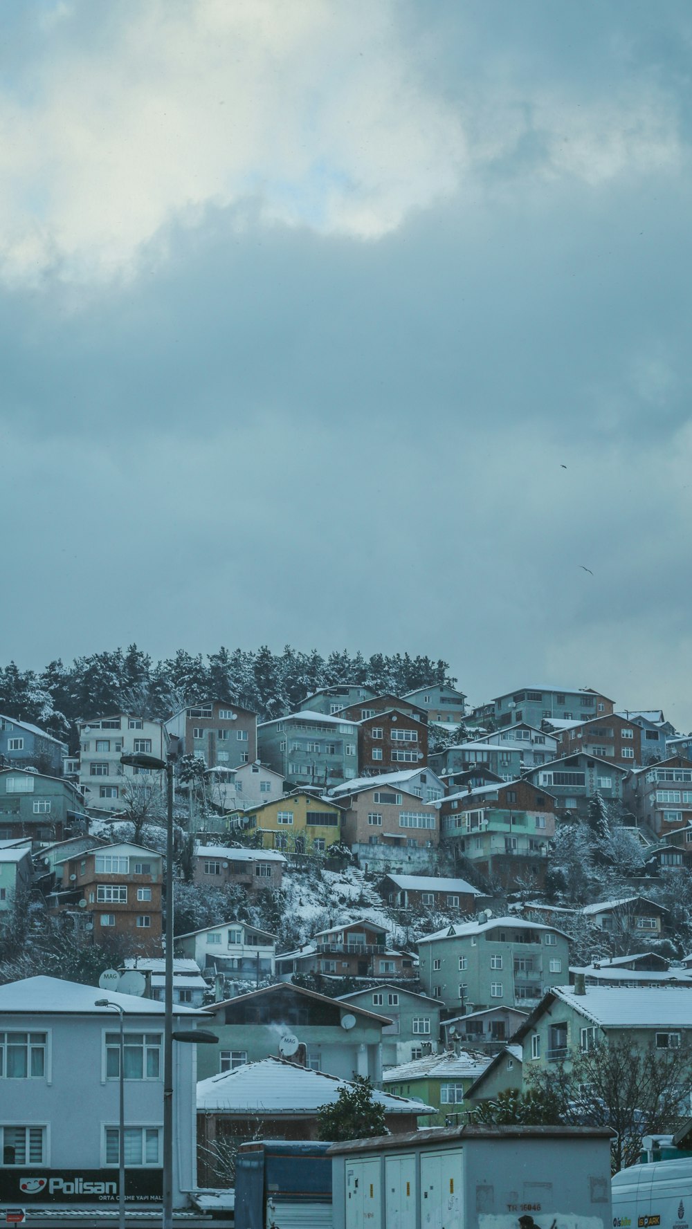 a view of a city with houses on a hill