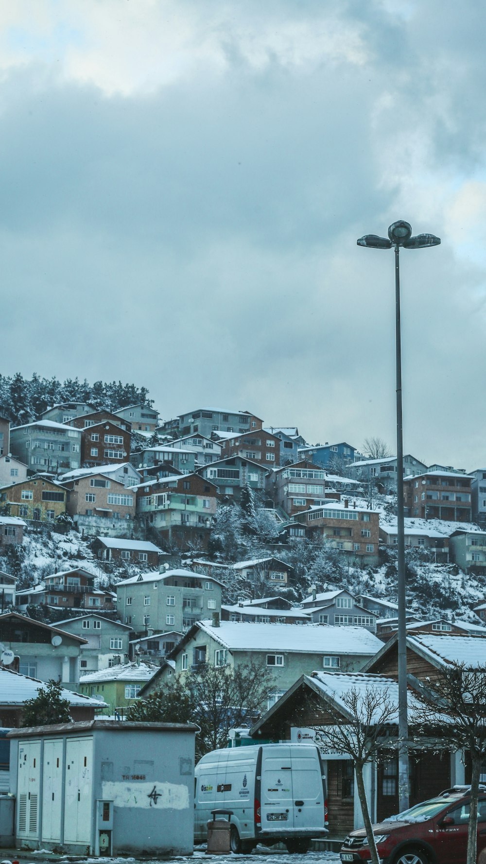 a city with lots of buildings and a street light