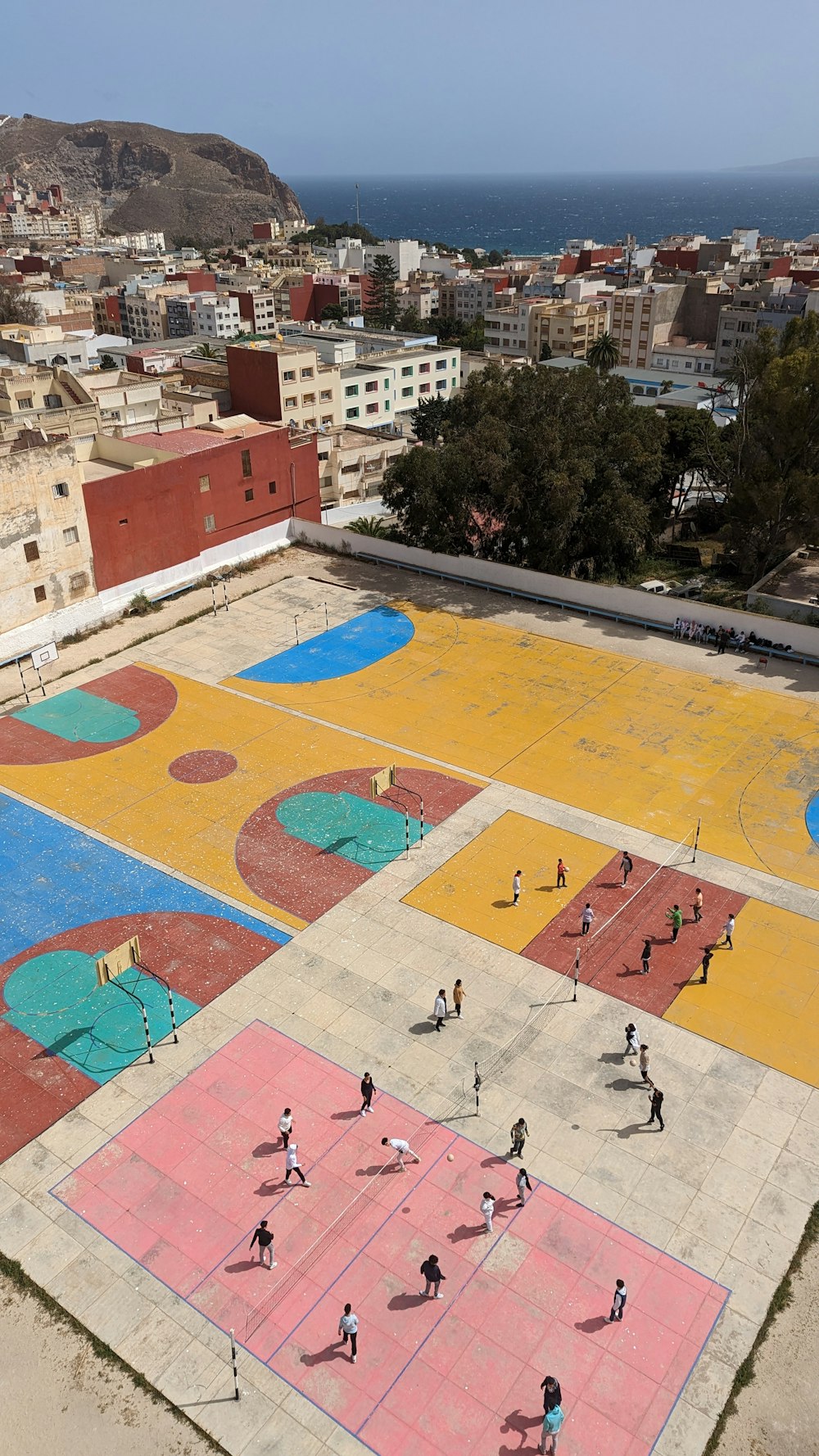 a group of people playing a game of basketball