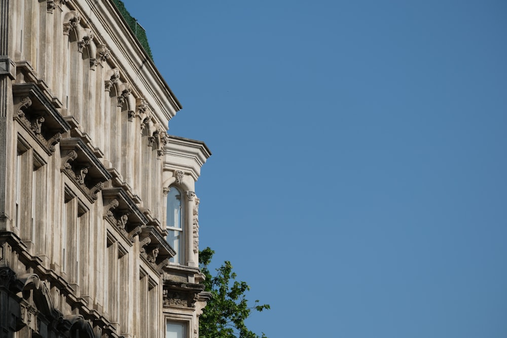 a tall building with a clock on the side of it