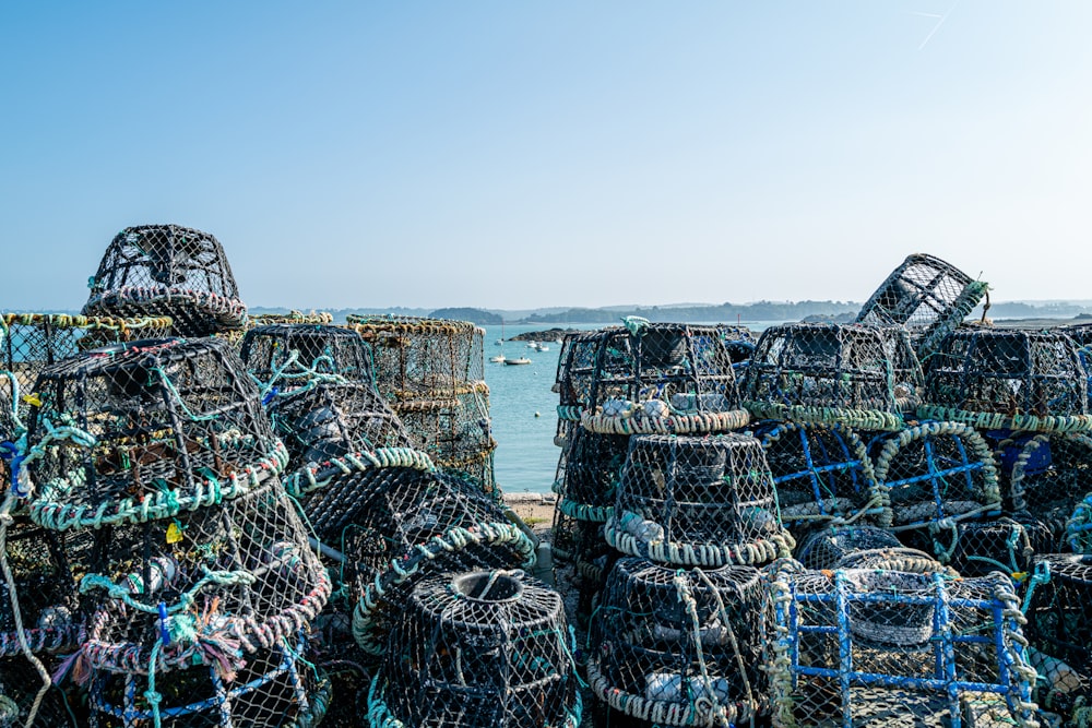 a bunch of fishing nets sitting on the beach