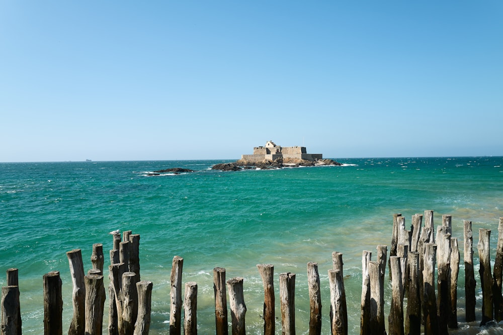 a view of a small island in the middle of the ocean