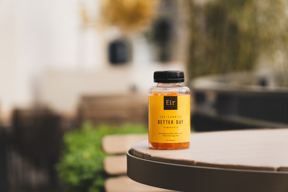 a bottle of tea sitting on top of a wooden table