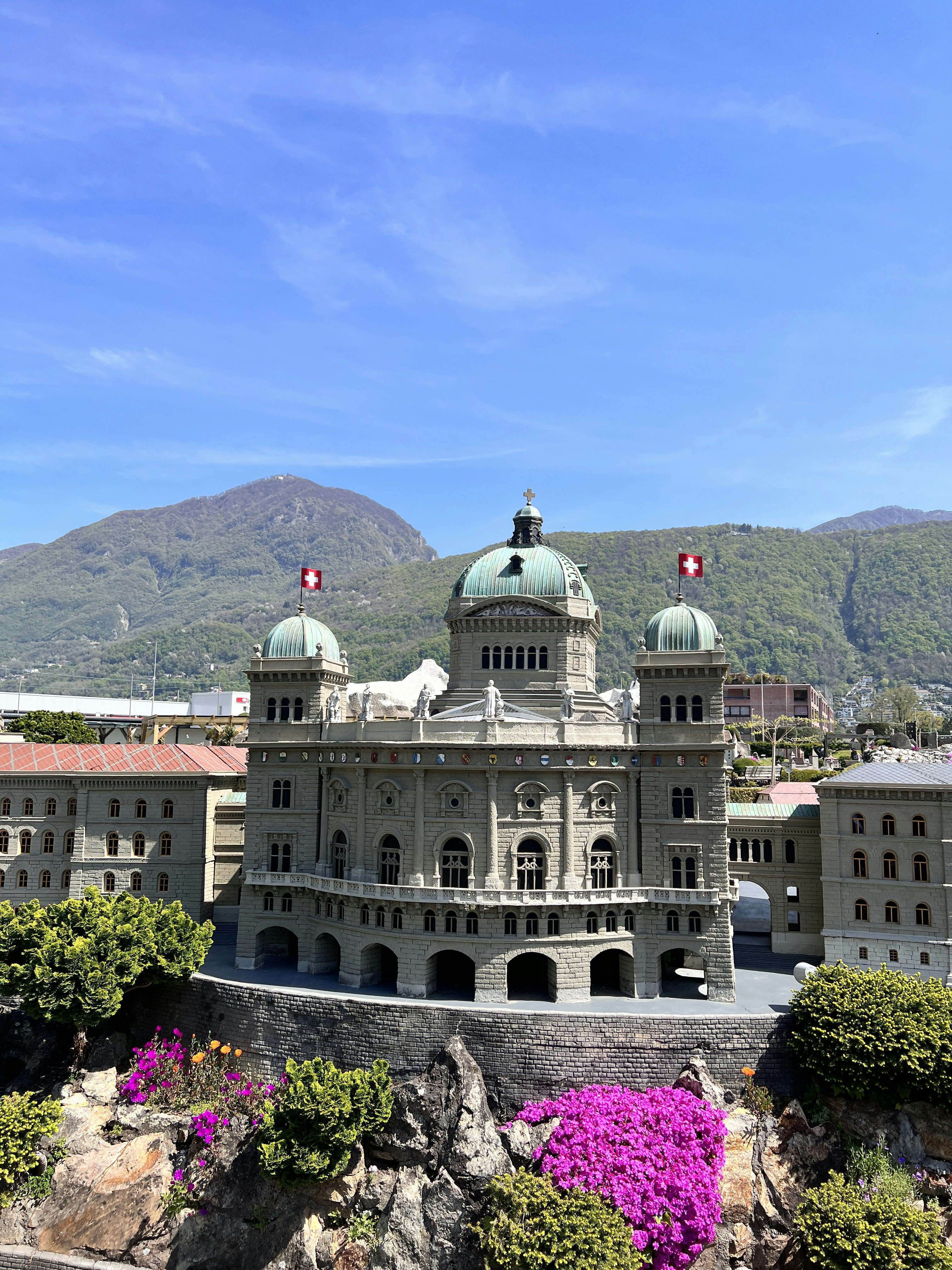 a large building with a green dome on top of it