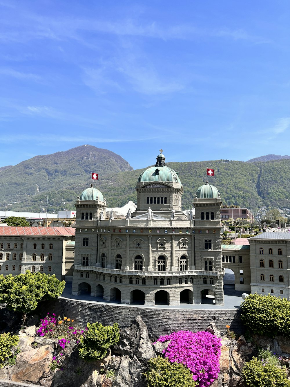 a large building with a green dome on top of it