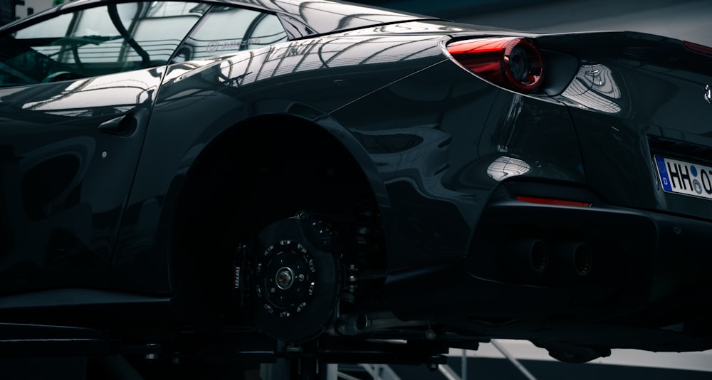 a car is parked on a lift in a garage