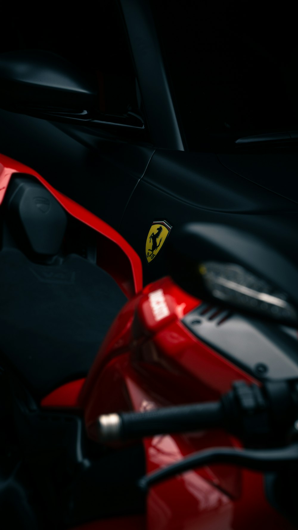 a close up of a red and black motorcycle