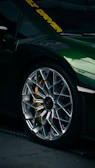 An elegant rim mounted on a high-end sports car with cinematic lighting.