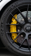 a close up of a tyre on a sports car 