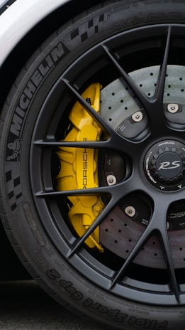 a close up of a tyre on a sports car 