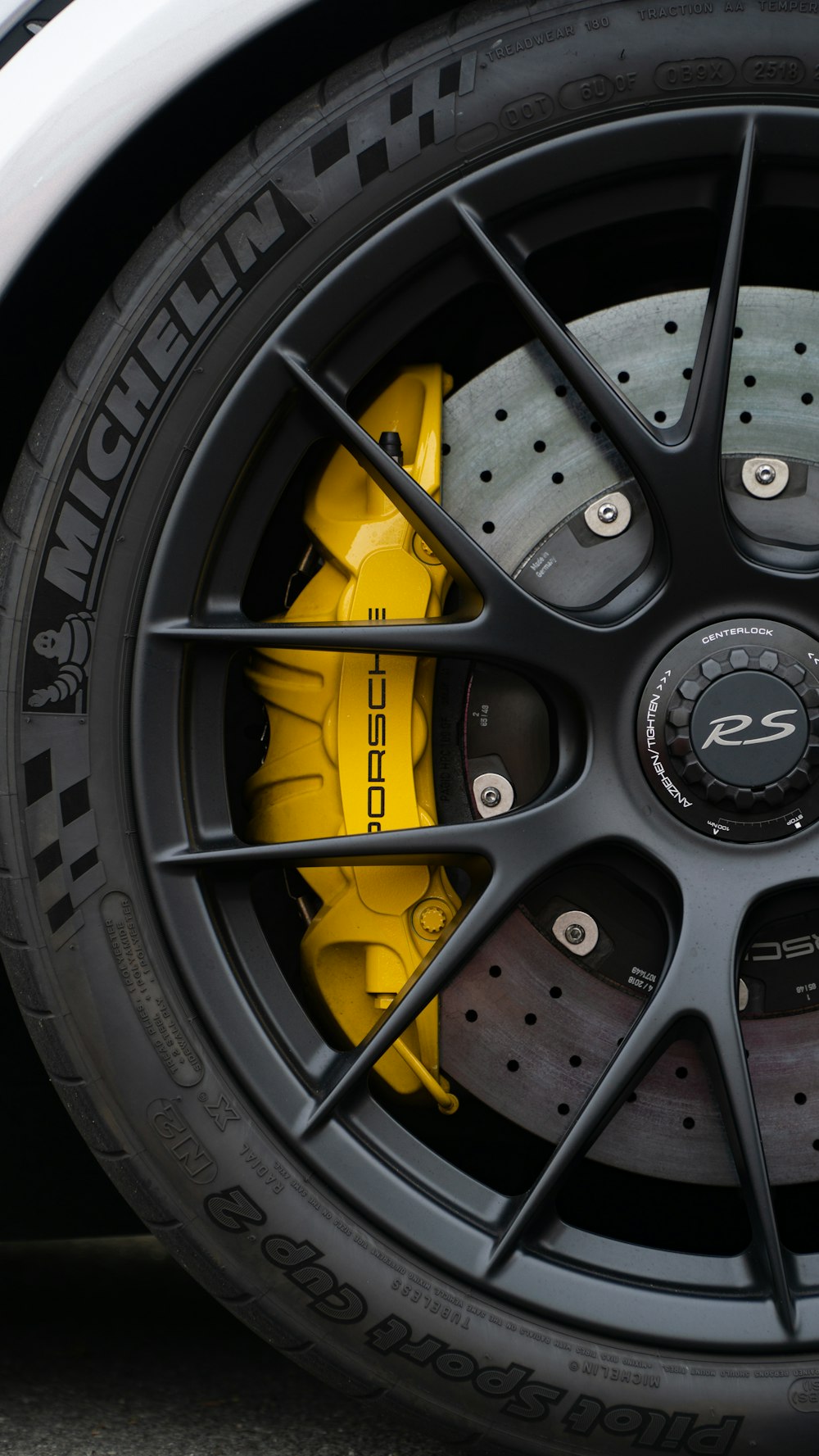 a close up of a tire on a sports car