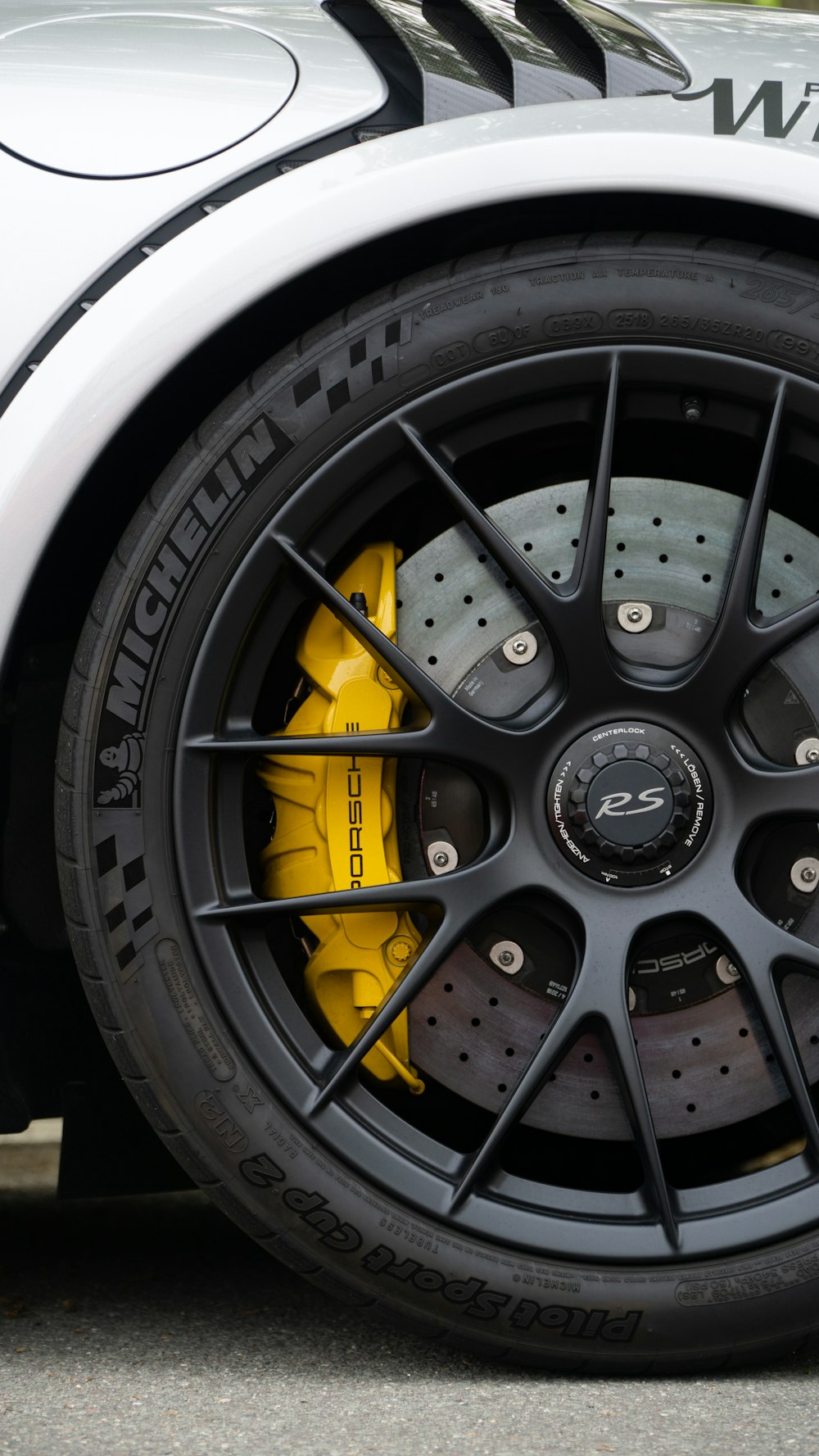 a close up of a tire on a sports car
