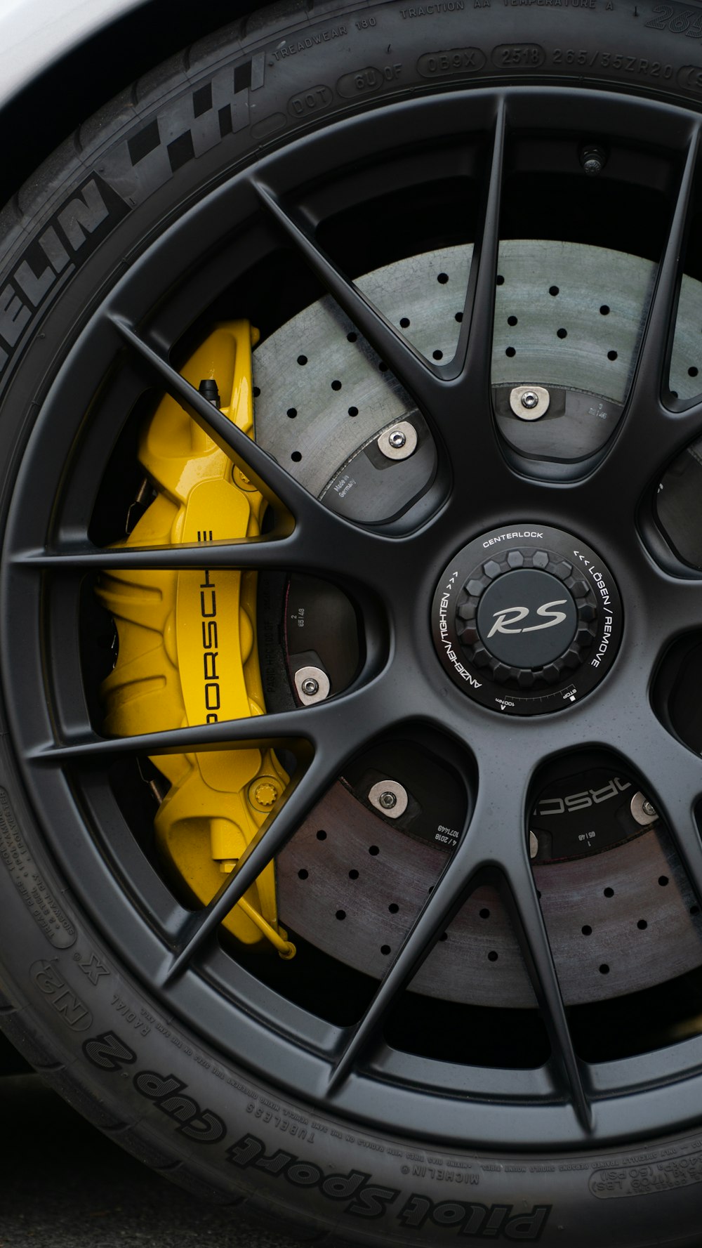 a close up of a tire on a sports car