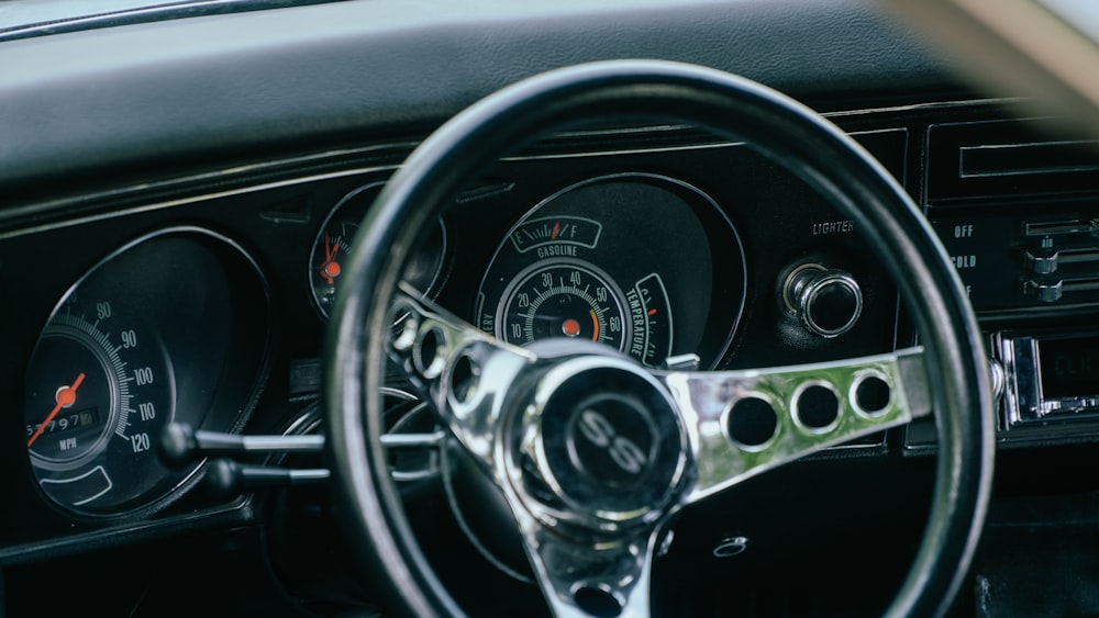 a steering wheel and dashboard of a car