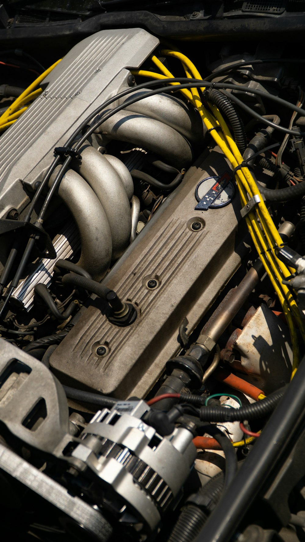 a close up of a car engine with many wires