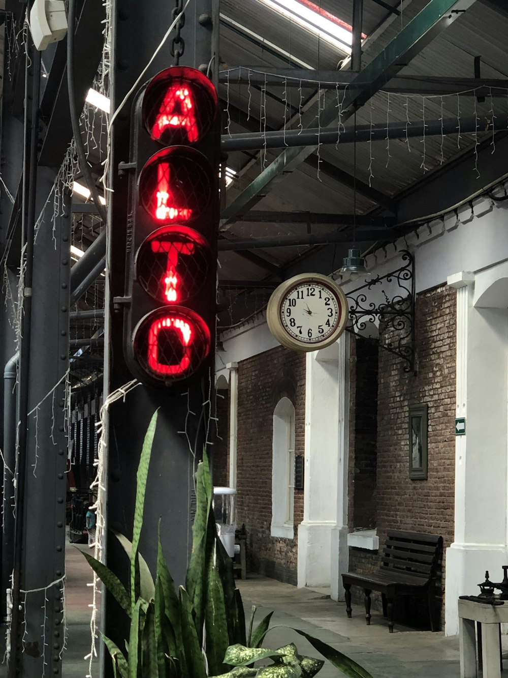 a clock that is on the side of a pole