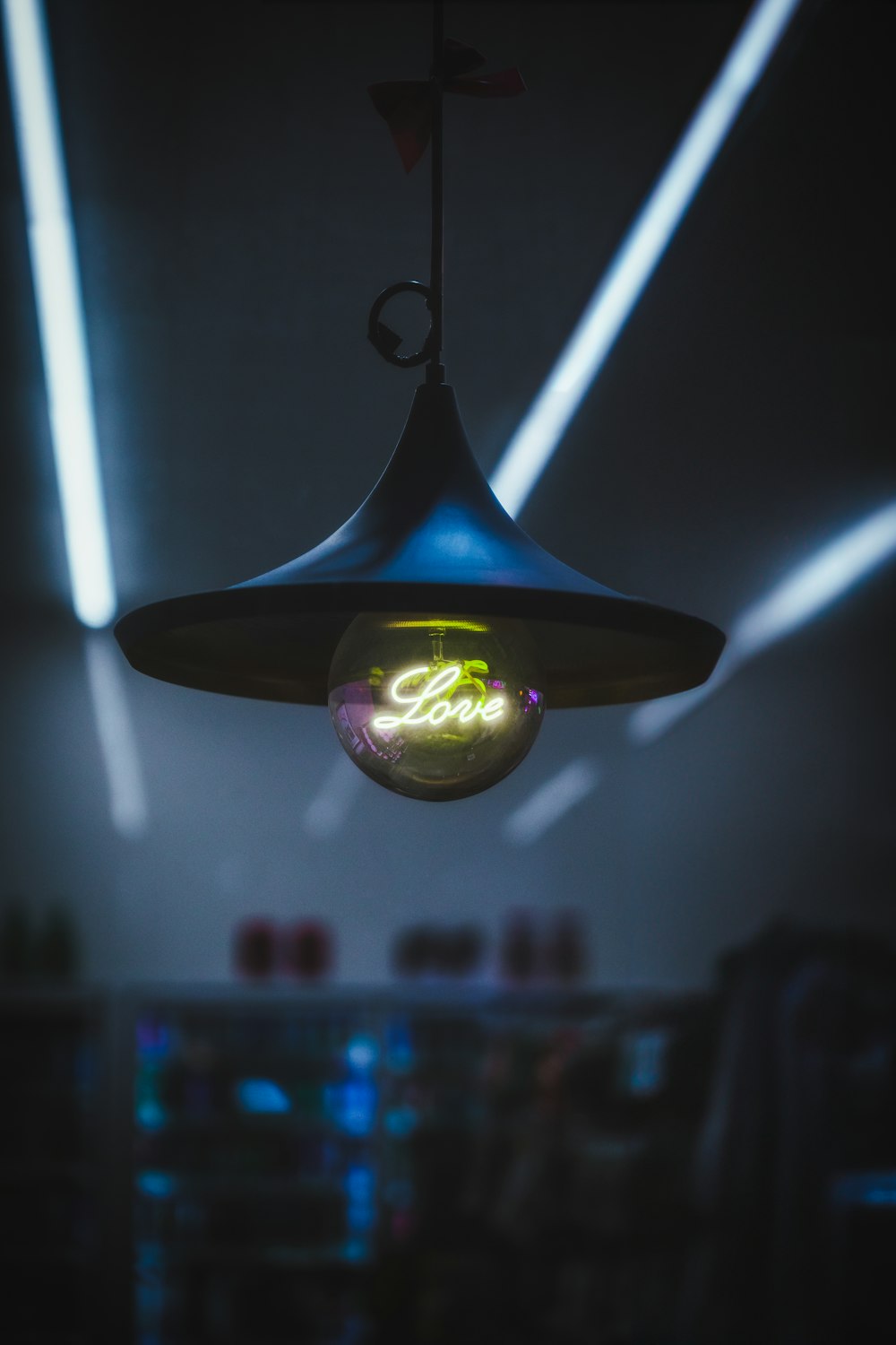 a light hanging from a ceiling in a room