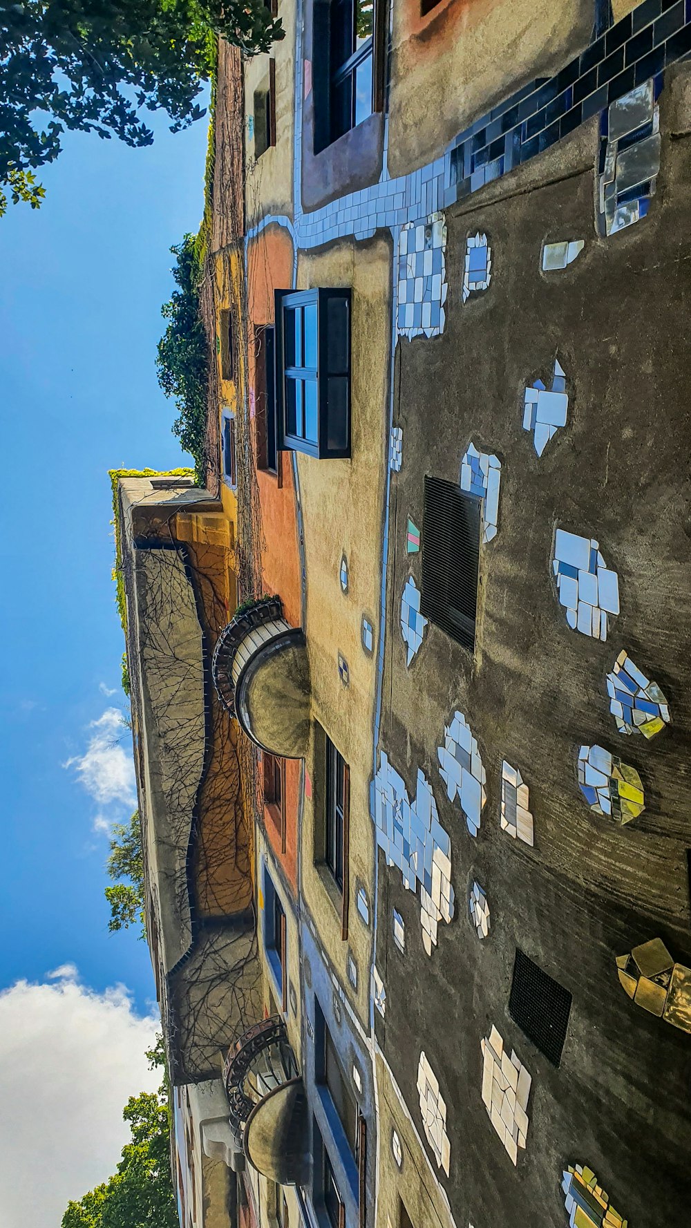 a reflection of a building in a puddle of water