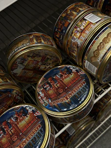 Stacks of sealed spice containers labeled for European markets.