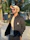 A man enjoying a sunny park wearing a trendy bucket hat