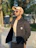 A man enjoying a sunny park wearing a trendy bucket hat