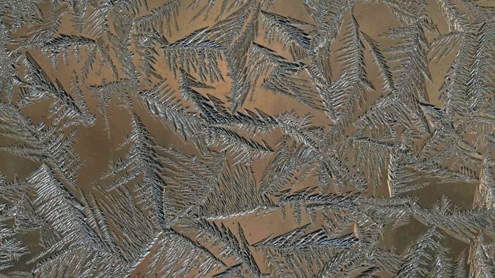 a close up view of a frosted window