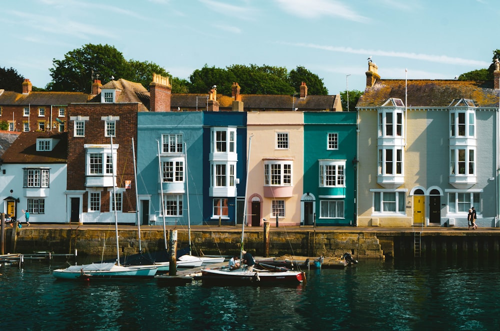 a row of houses next to a body of water