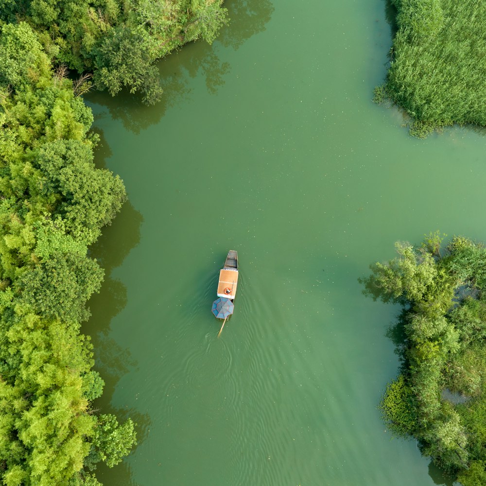 a small boat floating on top of a river