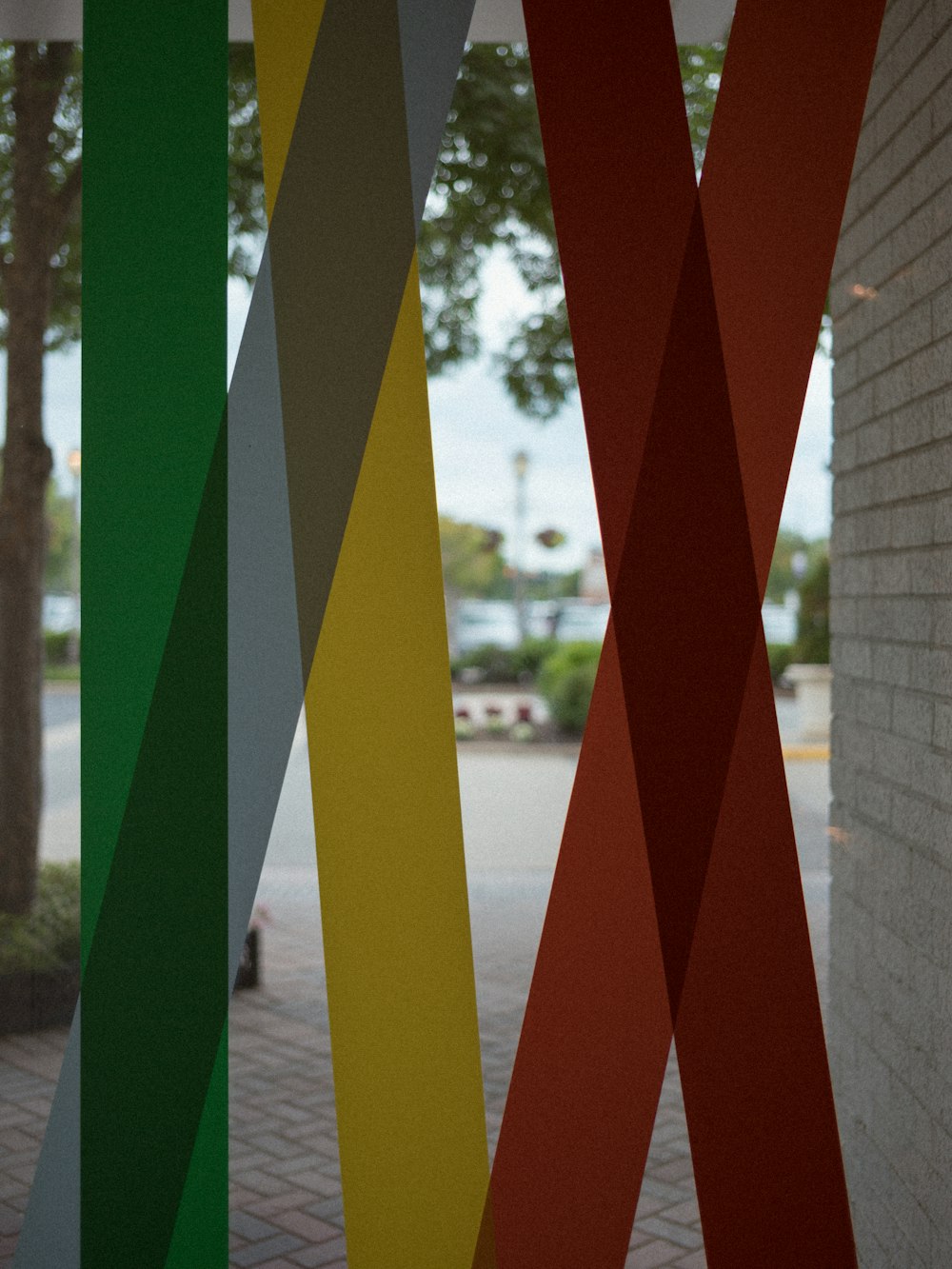 a close up of a multicolored sculpture near a building