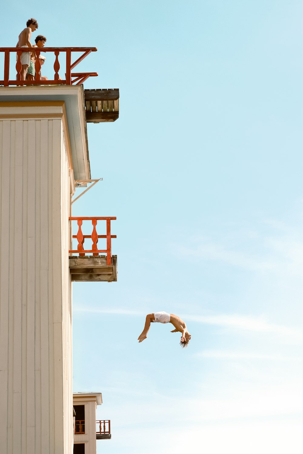 a person jumping off a building into the air