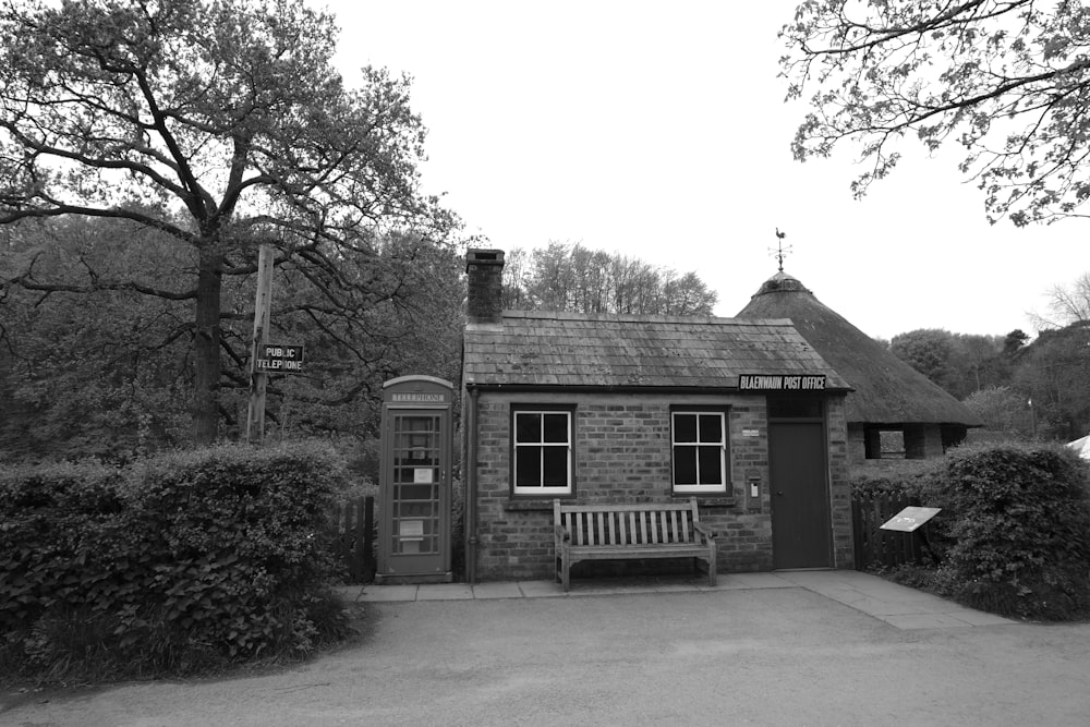 a black and white photo of a small building