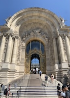 The entrance of the golden door point building with a large golden door welcoming visitors.