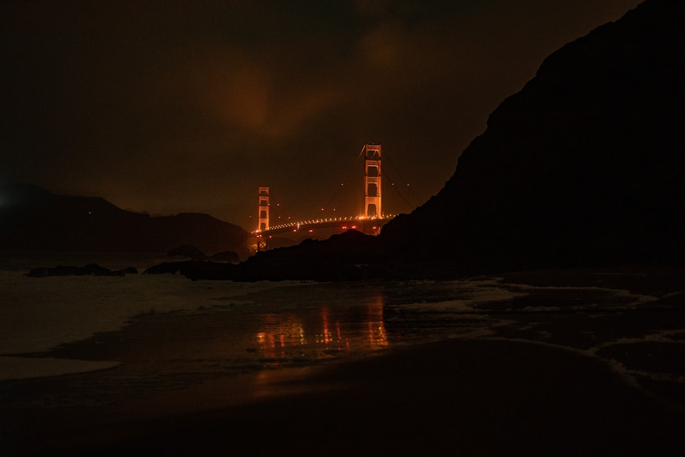 a view of the golden gate bridge at night