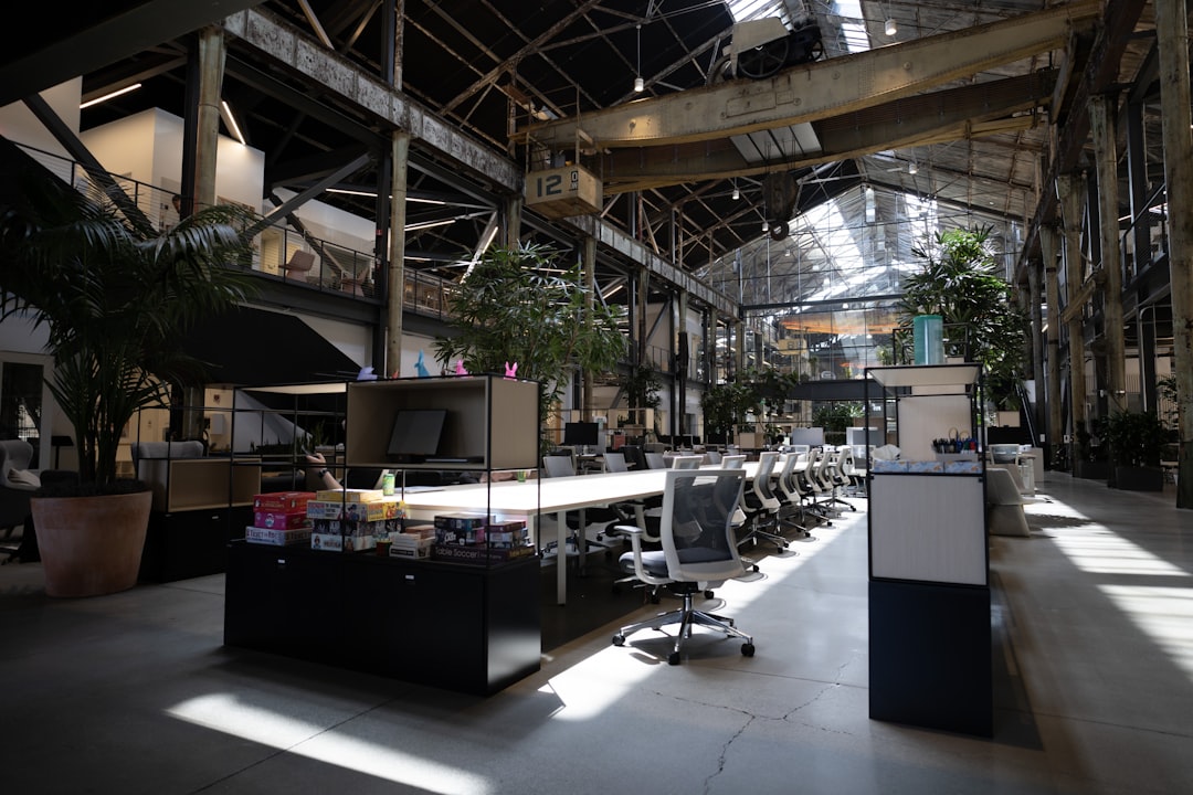 a large open room with a lot of desks and chairs,