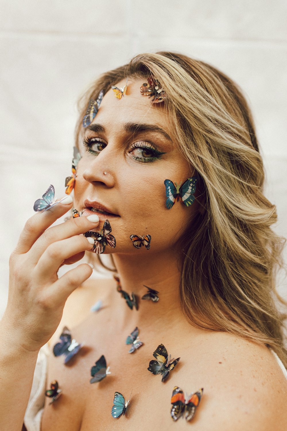 a woman with butterflies all over her body