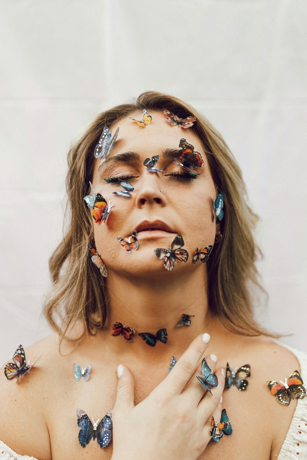 a woman with butterflies painted on her body