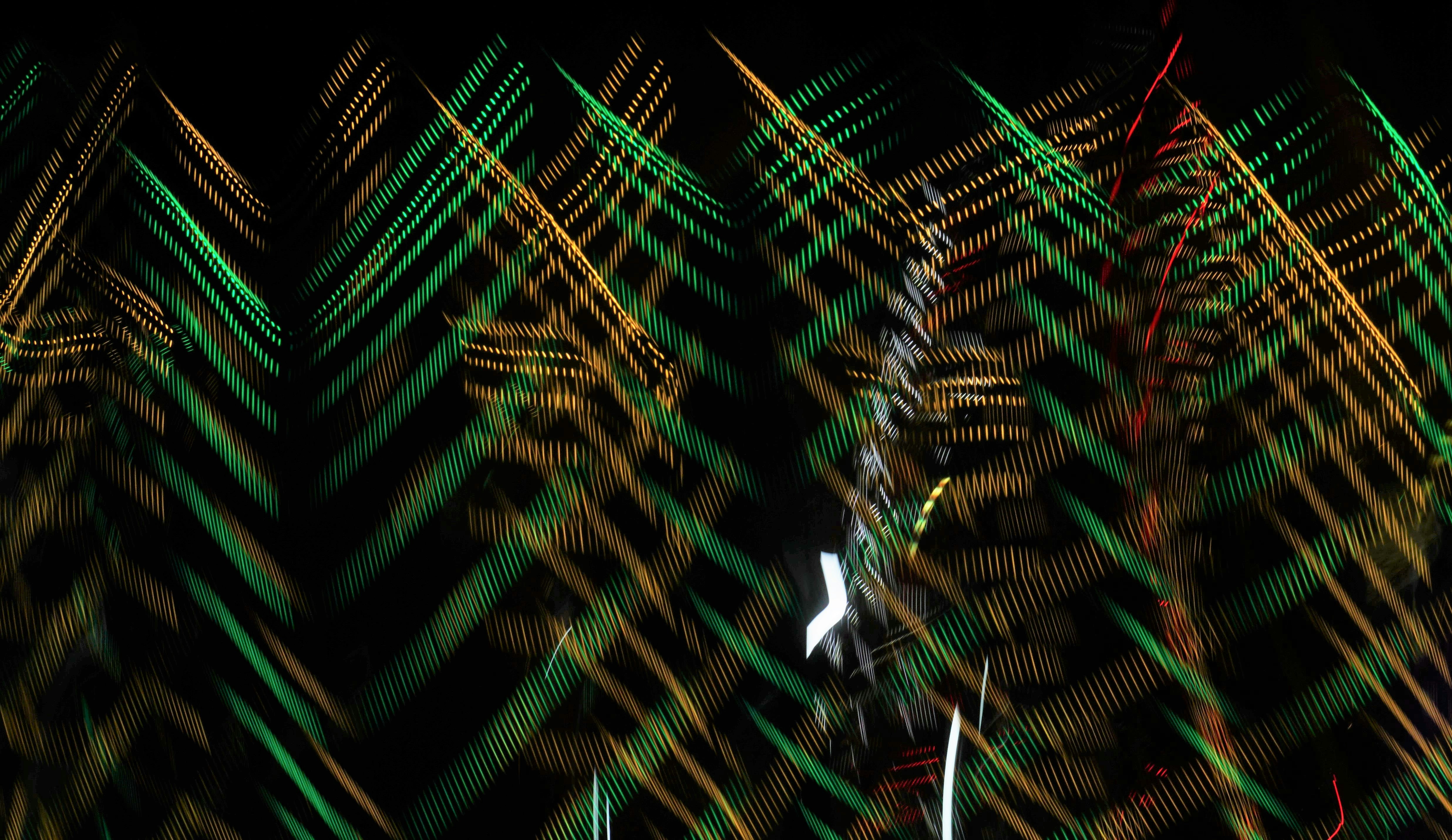 a blurry photo of a clock tower in the dark