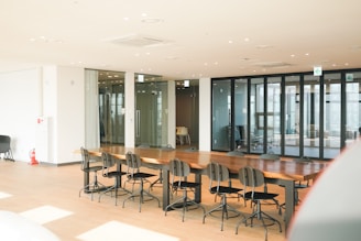 a conference room with a long table and chairs