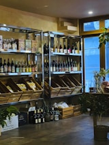A cozy store interior with customers browsing the beverage selection.