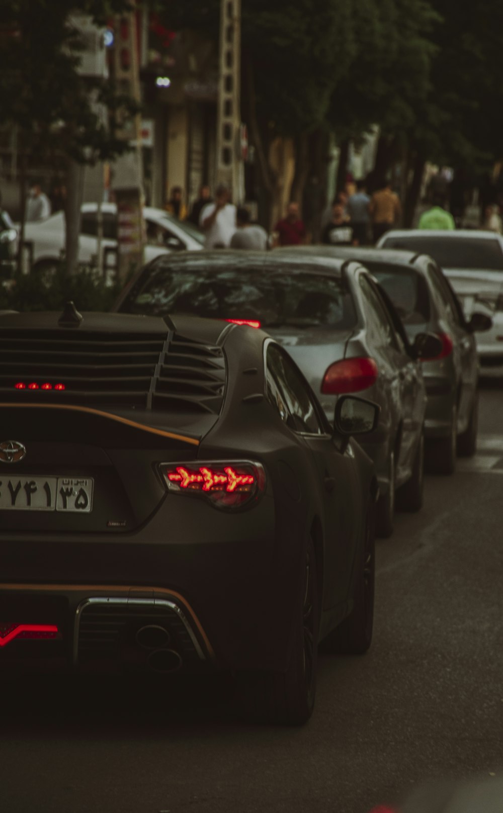 a group of cars parked on the side of a road