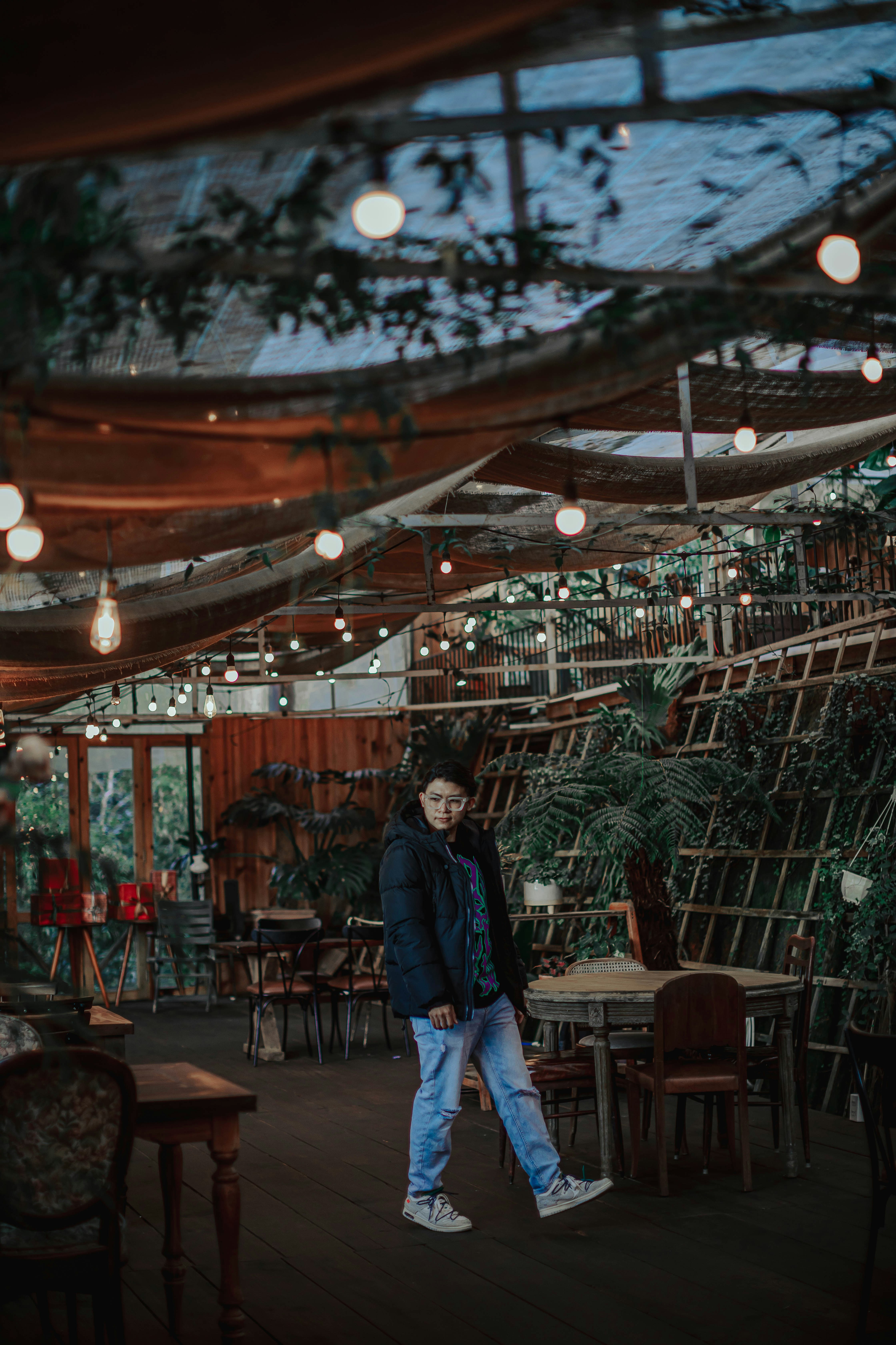 a person standing in a room with lots of lights