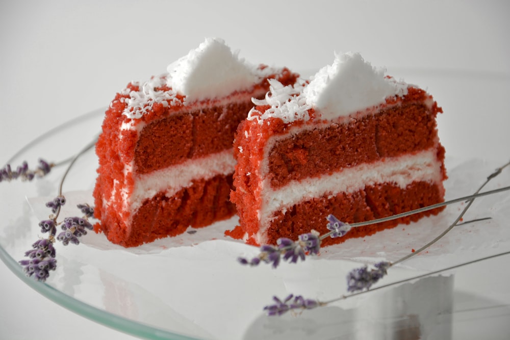 a piece of red velvet cake on a glass plate