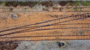 An aerial view of a bustling railway junction with multiple trains.