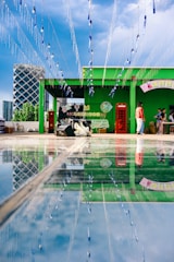 A vibrant community event showcasing digital service kiosks in the district office courtyard.